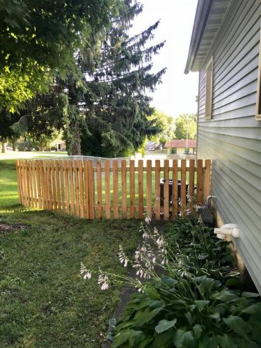 4' Cedar Picket added to a chain link fence for curb appeal 